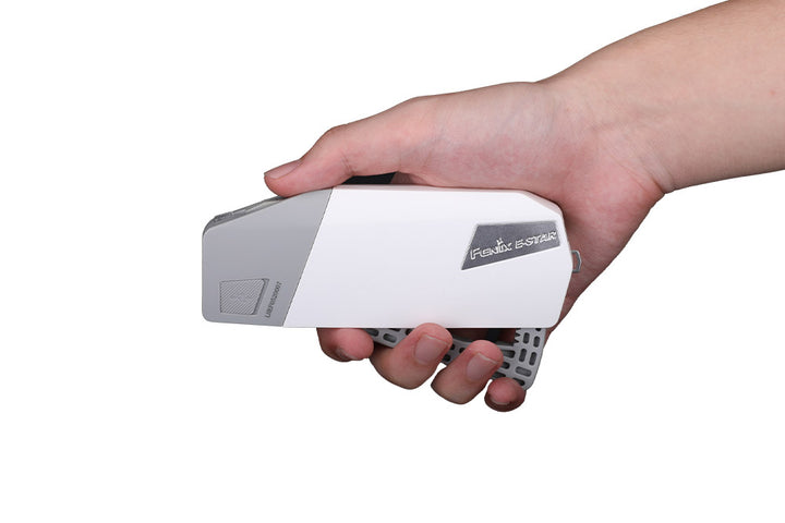 Fenix E-STAR emergency LED flashlight being charged by hand