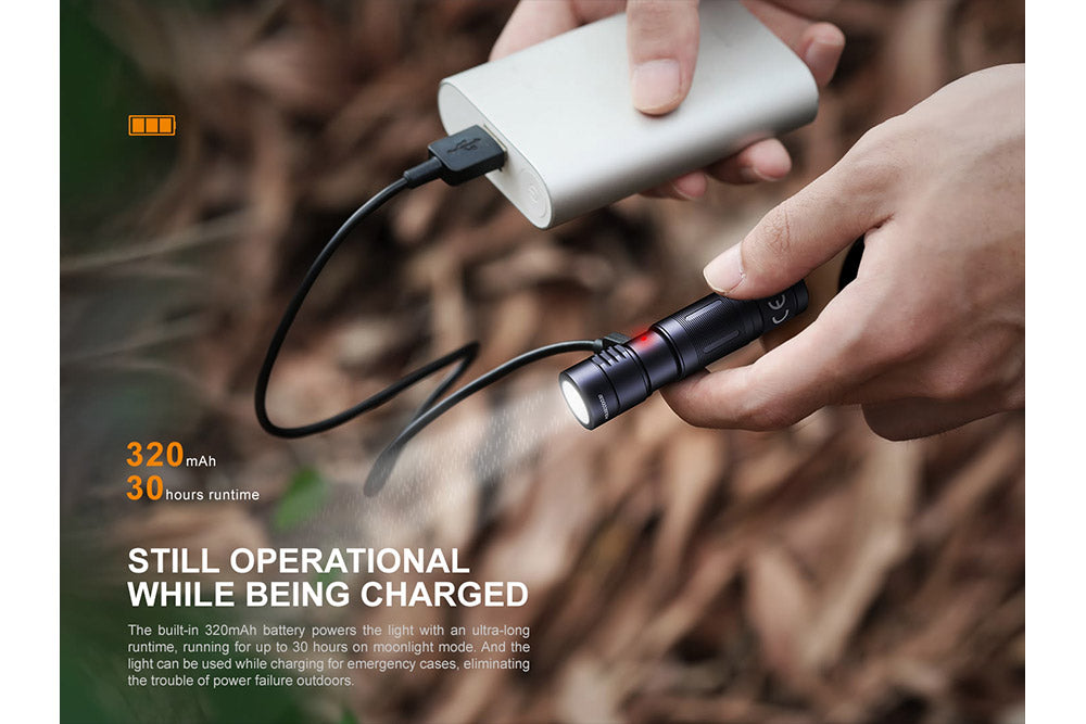 Fenix E05R Mini Keychain LED Flashlight being used while charging