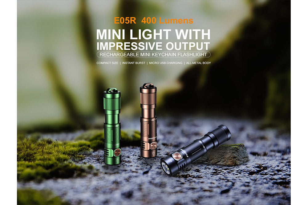 Fenix E05R Mini Keychain LED Flashlights on stone
