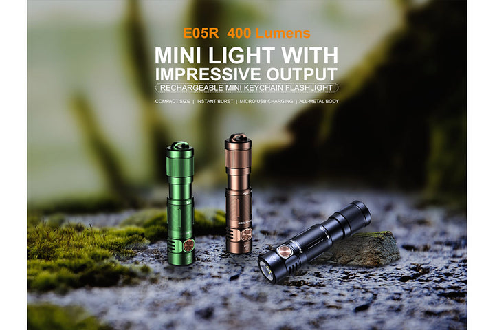 Fenix E05R Mini Keychain LED Flashlights on stone