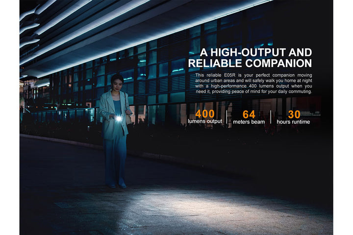 Fenix E05R Mini Keychain LED Flashlight used while walking at night in the city