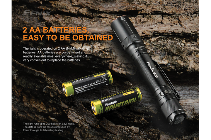 Fenix E20 V2 EDC Flashlight with AA batteries on wooden bark surface