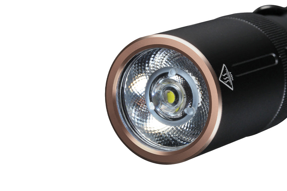 Close up image of the lens of the Fenix E20 V2 EDC Flashlight 