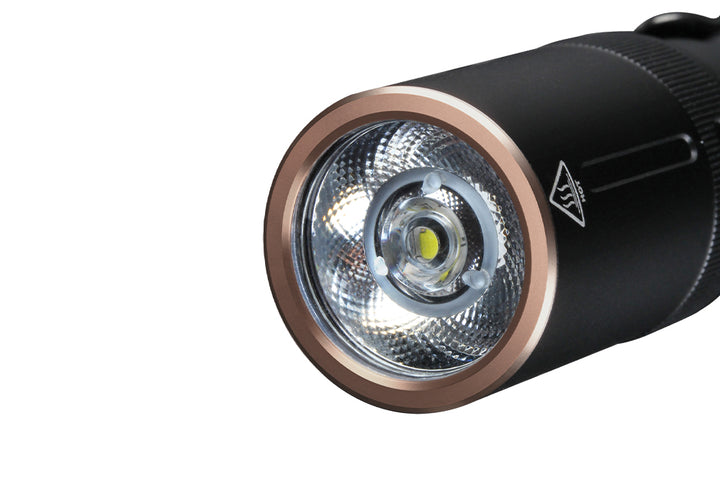 Close up image of the lens of the Fenix E20 V2 EDC Flashlight 