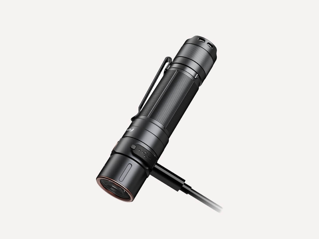 Fenix E35R high-performance rechargeable LED flashlight plugged in to charge