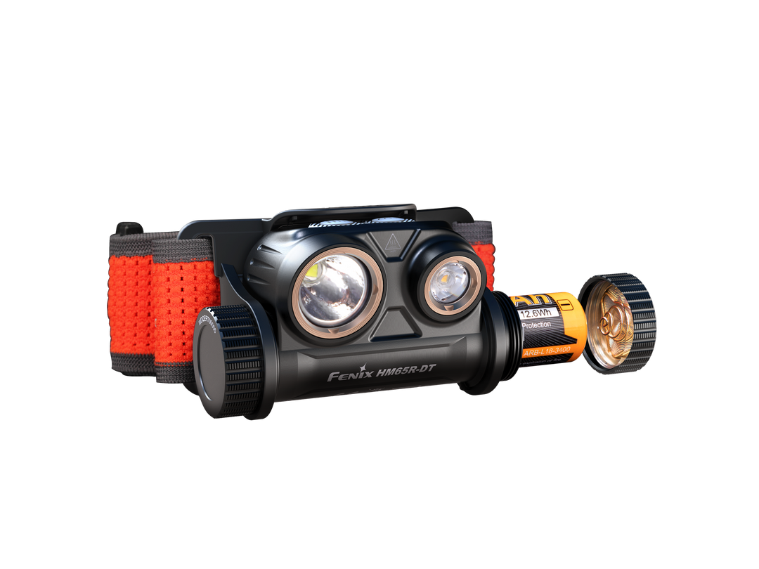 Fenix HM65R-DT trail running headlamp viewed from the front with the battery being removed
