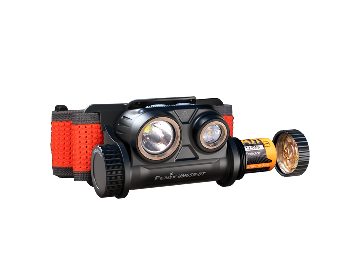 Fenix HM65R-DT trail running headlamp viewed from the front with the battery being removed