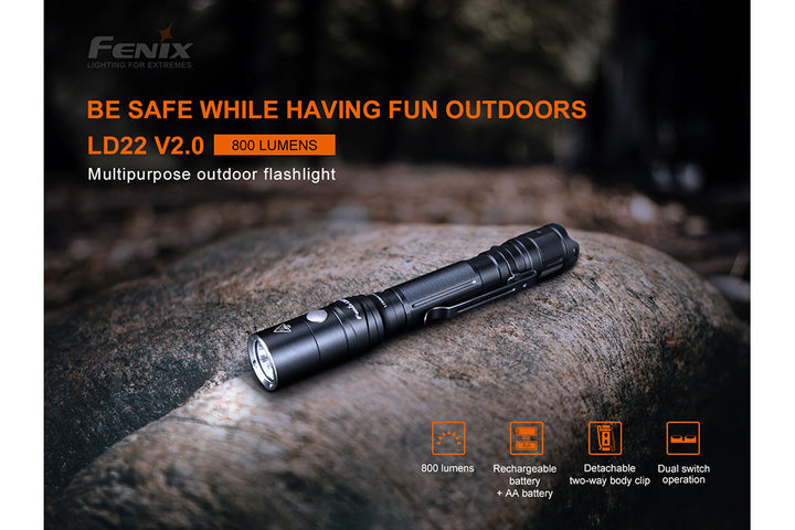 Fenix LD22 V2 compact LED flashlight on stone