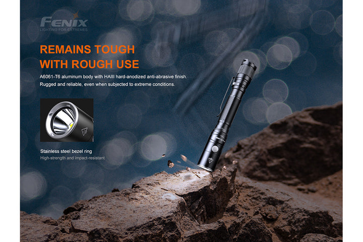 Fenix LD22 V2 compact LED flashlight dropped on stone