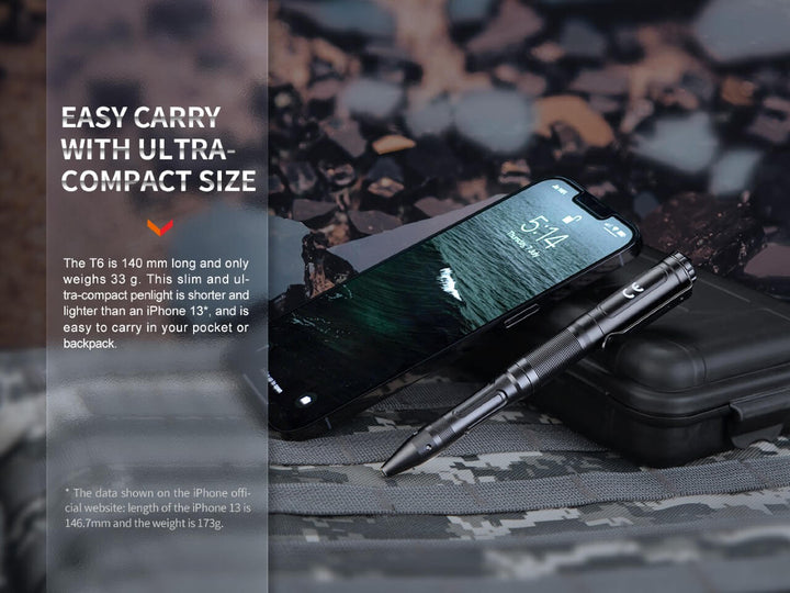 Fenix T6 Tactical Pen Light next to a cell phone to show its size